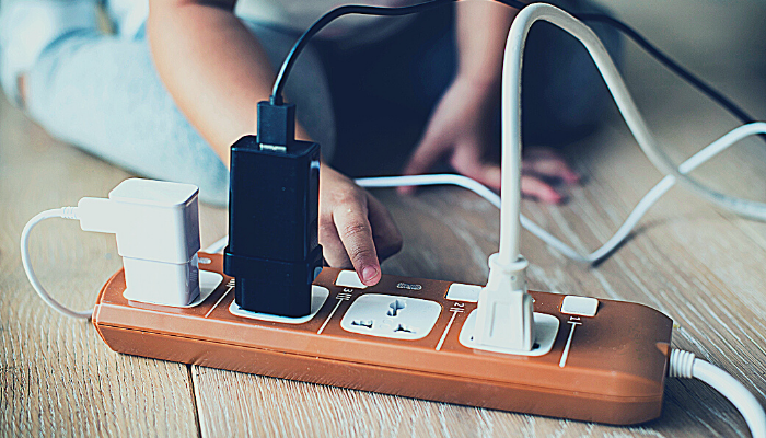 Power distributor with three cords plugged in